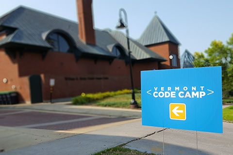 Building with sign reading Vermont Code Camp in the foreground